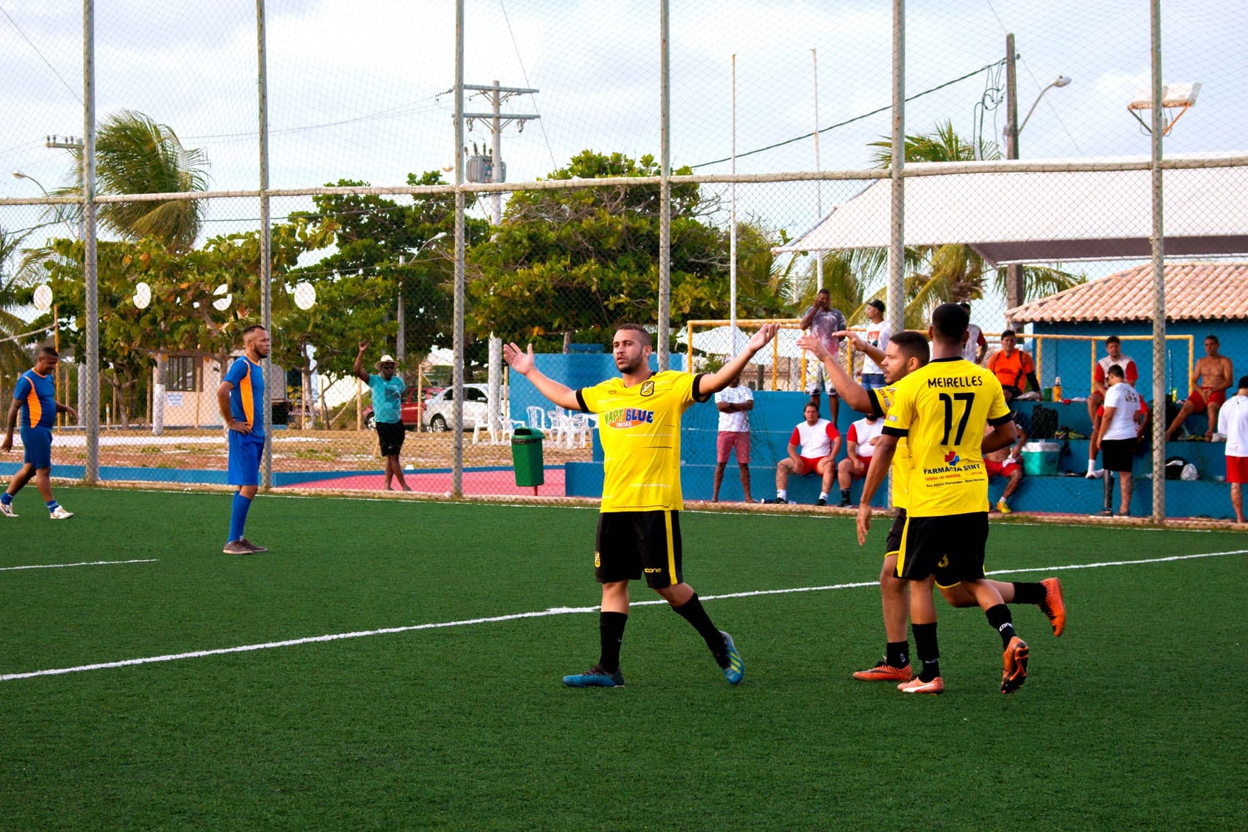 Soccer team in yellow jerseys on the field